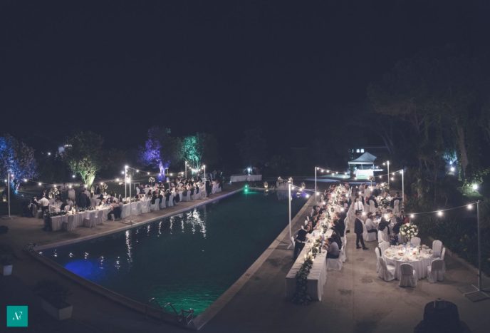 pool wedding by night